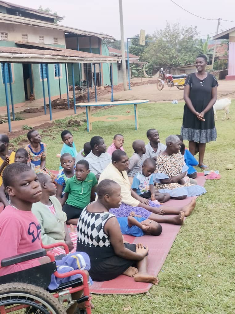 KTDA LIMITED (BUMI) members donating a wheelchair to a disabled person